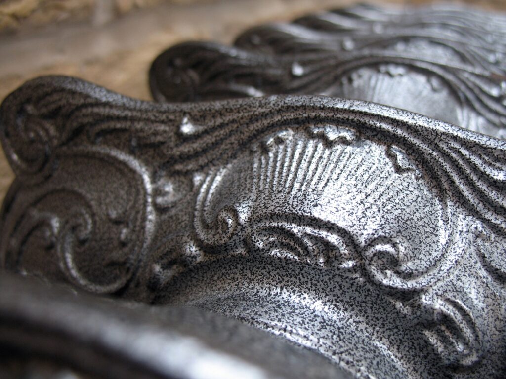 close up detail of scroll designs common on vintage cast iron radiators